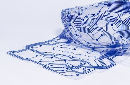 High-resolution image of a flexible printed circuit on a transparent substrate, showcasing modern manufacturing in printed electronics.