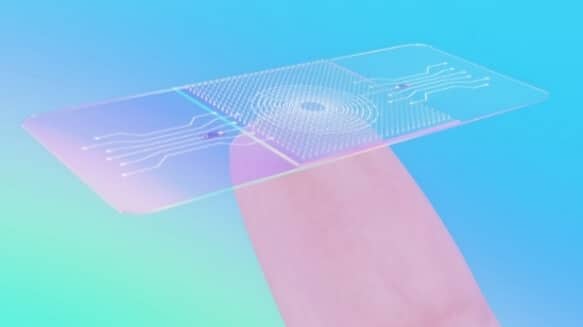 Close-up of a wearable printed sensor applied to a fingertip, highlighting advancements in medical and wearable electronics.